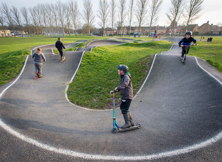 children playing on pump track